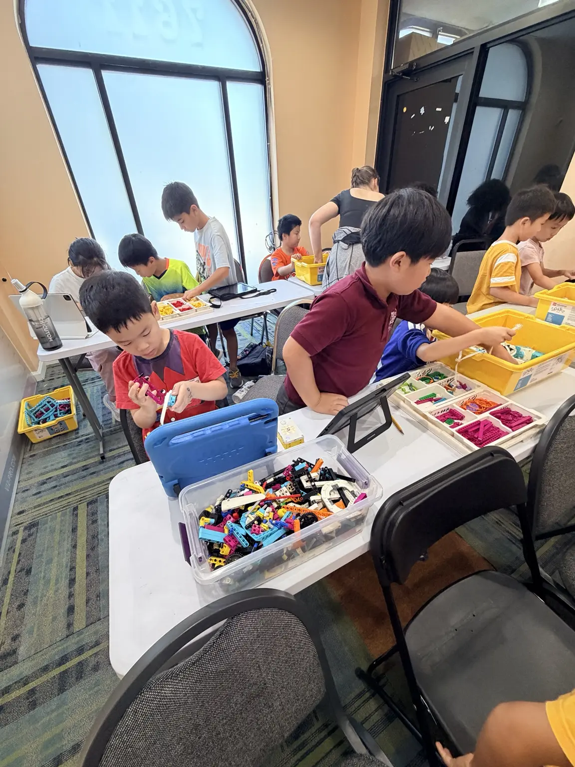 Students building LEGO robotics projects at Morning Star Campus